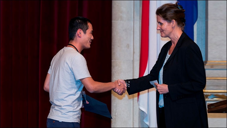 ACM Europe Council / ACM-W Europe Executive Committee member Gabriele Anderst-Kotsis congratulating Best Student Paper Award co-recipient Xiao Han.