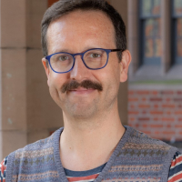 A portrait photograph of Alex Lucas
