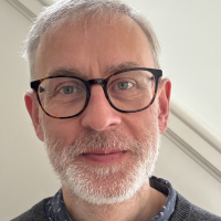 A portrait photograph of Paul Cairns