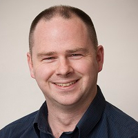 A portrait photograph of Raymond Holt