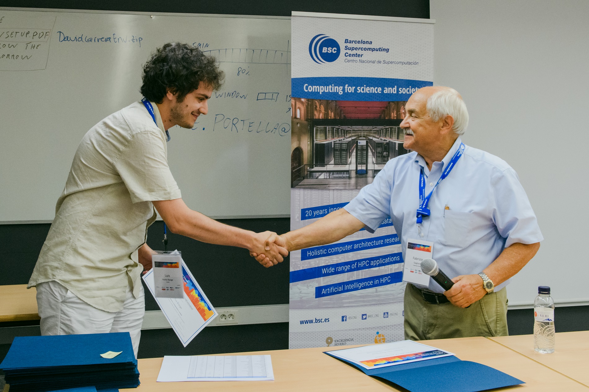 Photo of Rubén Laso Rodríguez receiving a certificate of honor at the 2019 ACM Europe Summer School on “HPC Computer Architectures for AI and Dedicated Applications”